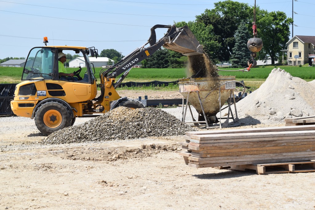 6-28-22: Loading stone for backfilling foundations
