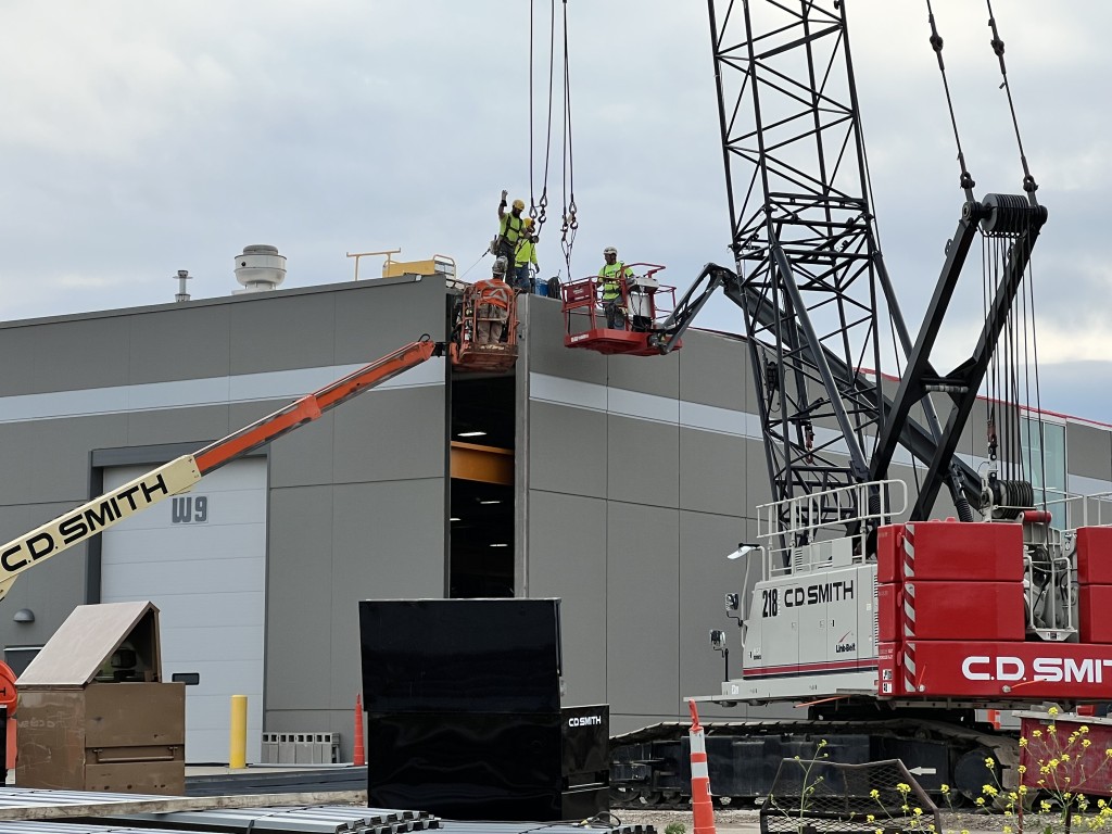 7-11-22: Precast panels are removed from the current facility and relocated to the new south exterior