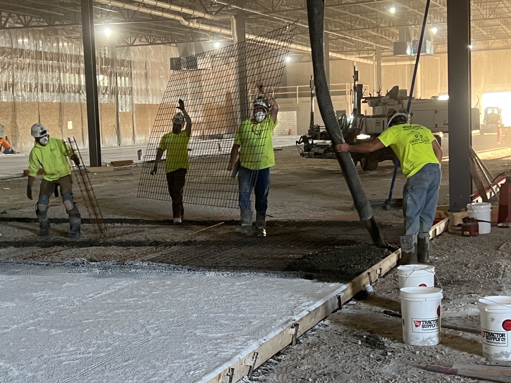 9-22-22: Concrete is pumped in place for the new plant floor
