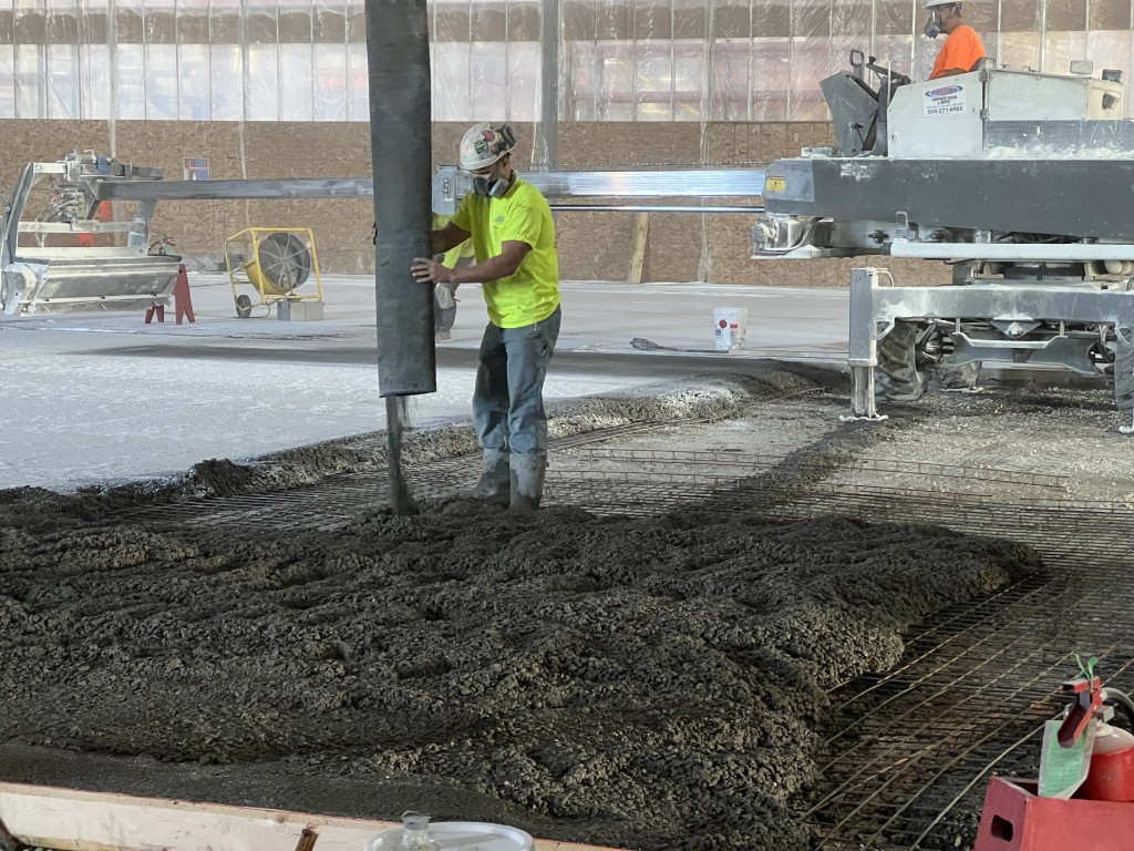 9-22-22: Concrete is pumped in place for the new plant floor