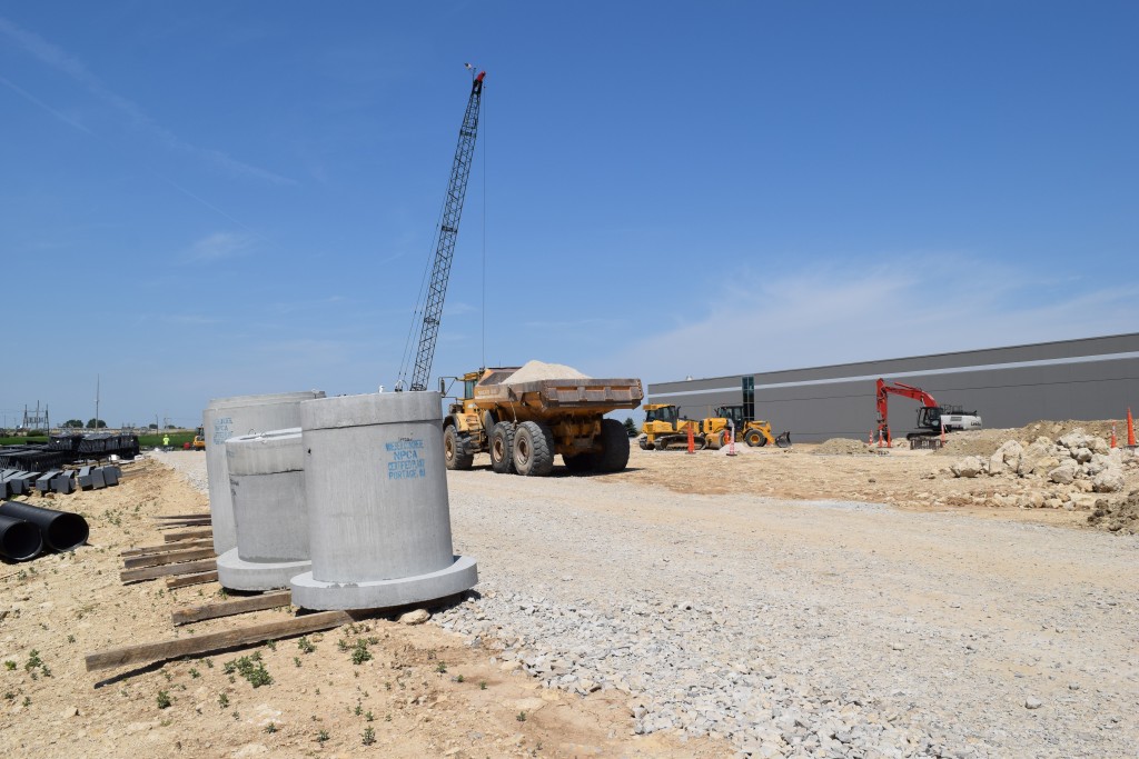 6-28-22: Manholes for the roof drainage system and storm water to be installed on the east side of the building