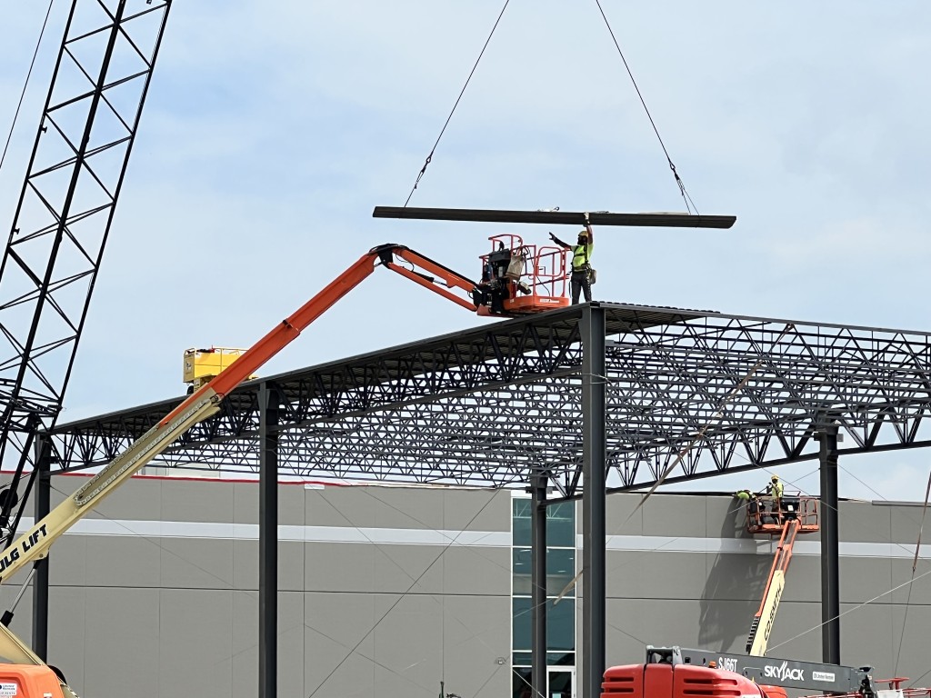 7-7-22: Roof decking is lifted and attached 