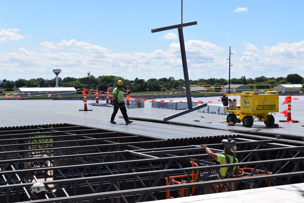 8-4-22: Audio communications guide the crane operator in delivering materials to crews