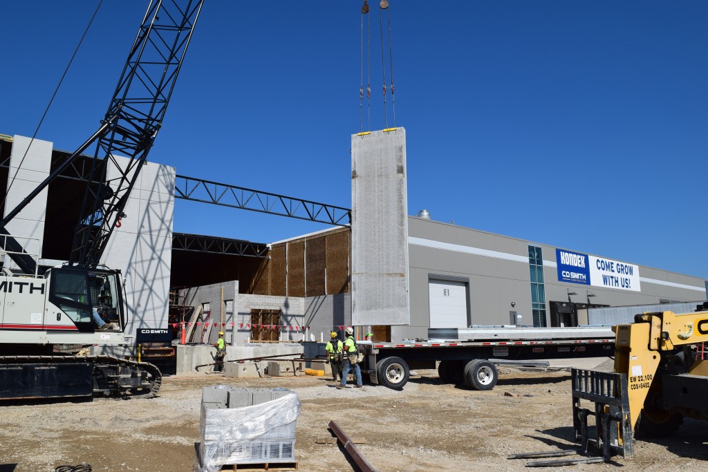 8-10-22: Crane lifting the east facing wall panels into place