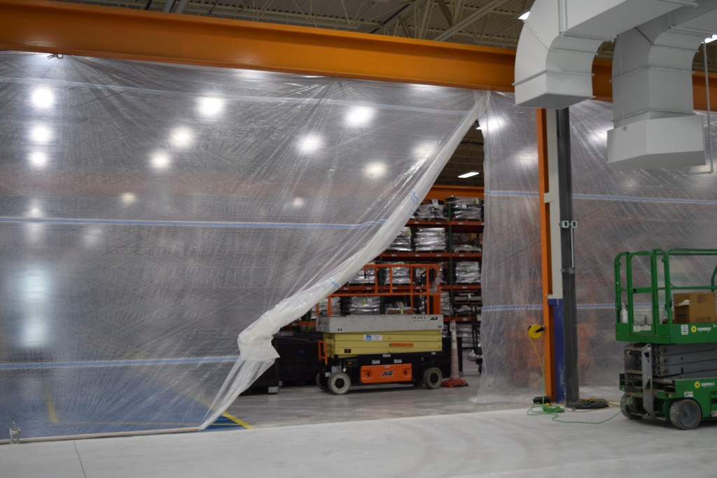 11-14-22: A dust curtain temporarily remains between the current plant and expansion
