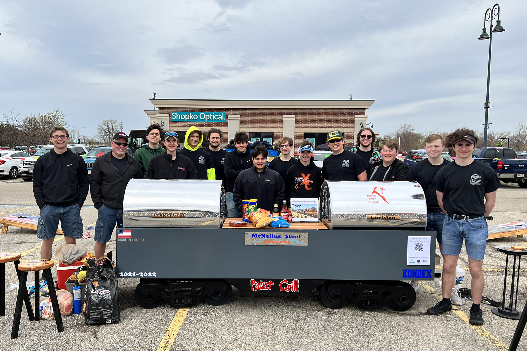 The North Fond du Lac Project GRILL team poses in front of their custom-built grill