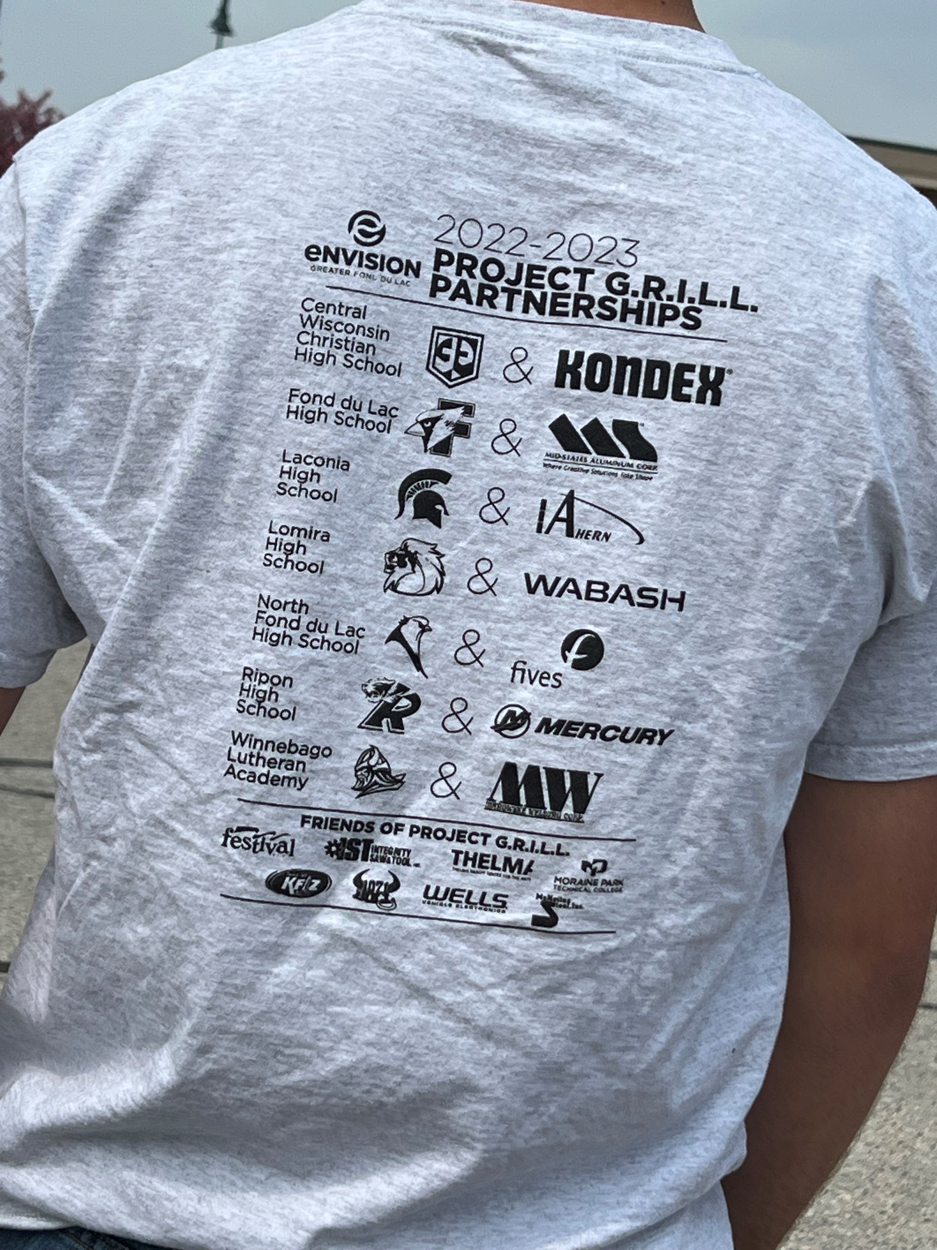 2022-2023 Project G.R.I.L.L. t-shirt showing school partnerships