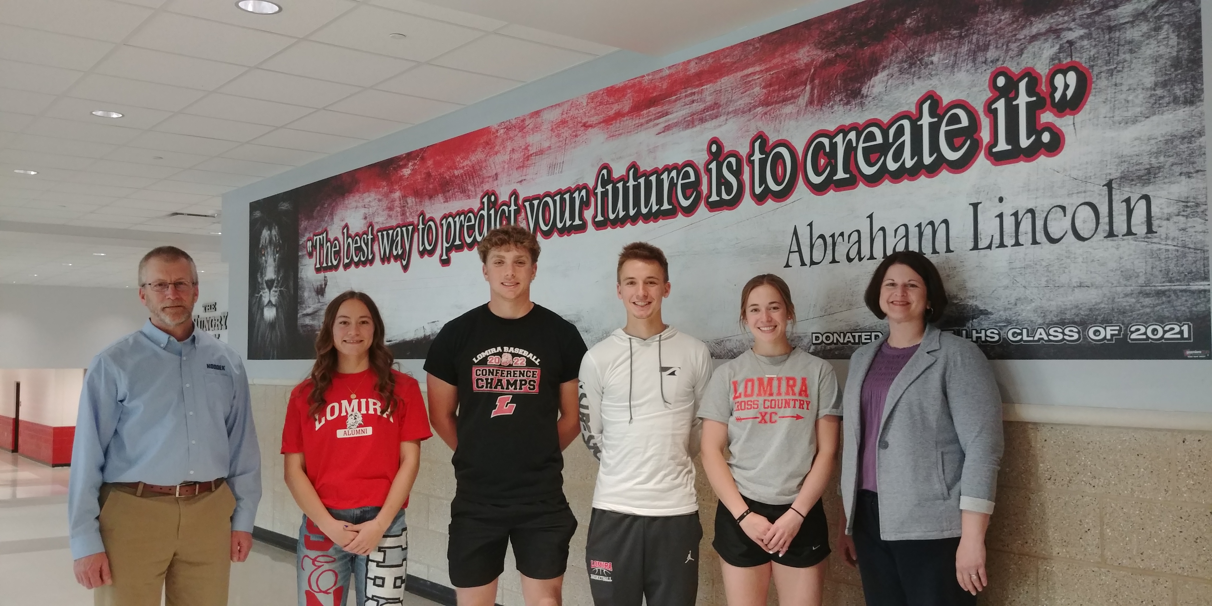 Kondex representatives standing shoulder to shoulder with student scholarship winners