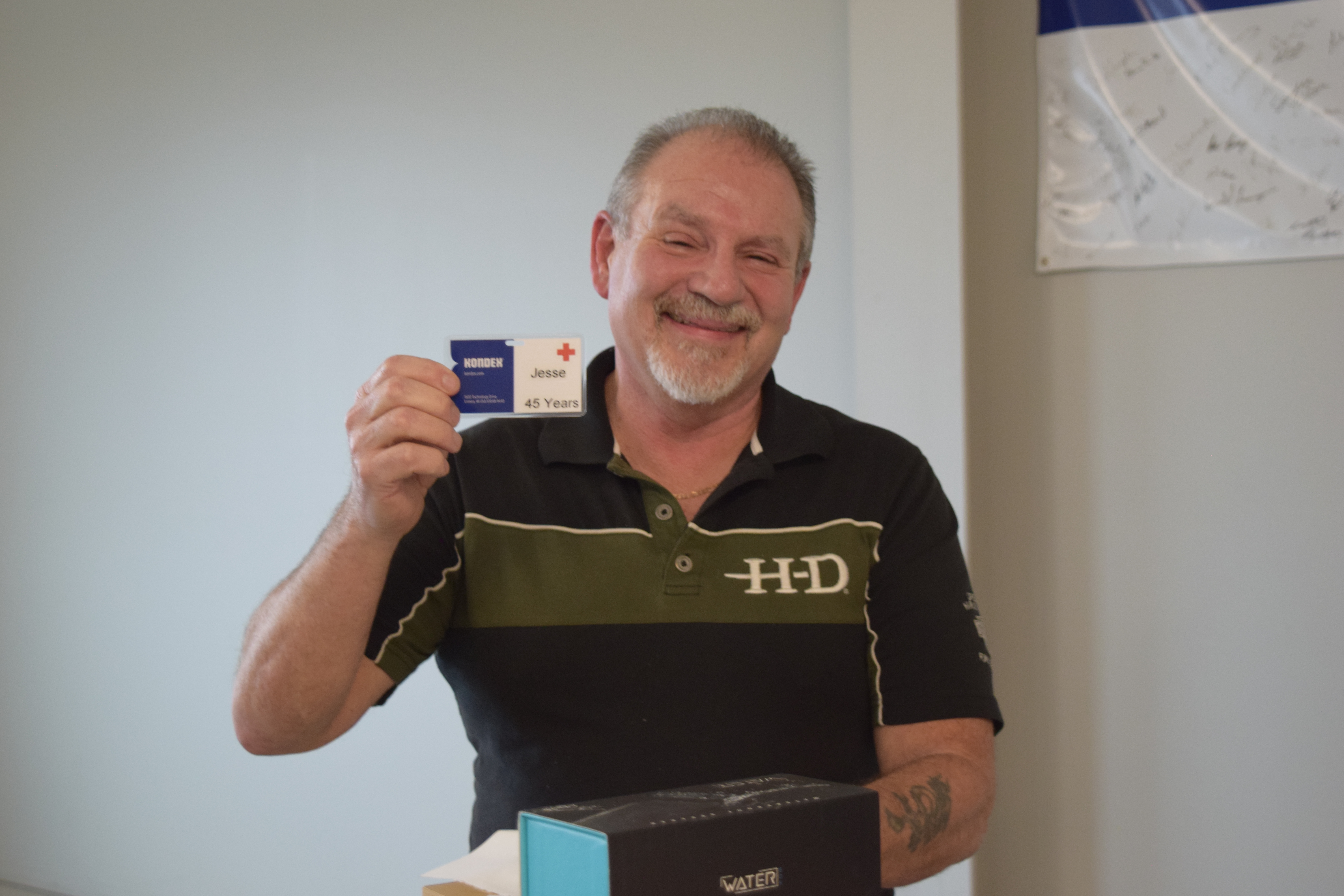 Jesse holding his 45th anniversary name badge