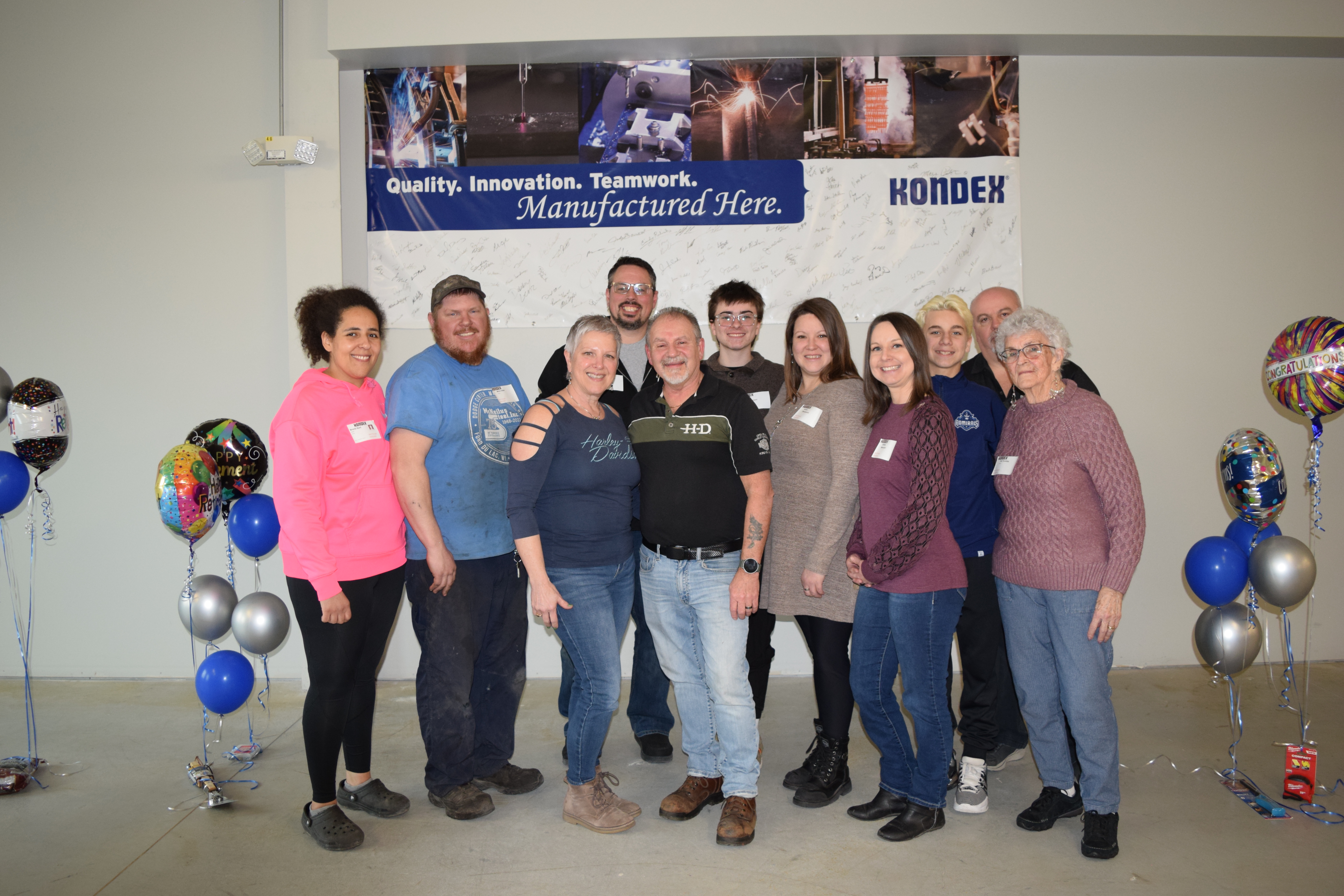 Jesse standing with his family